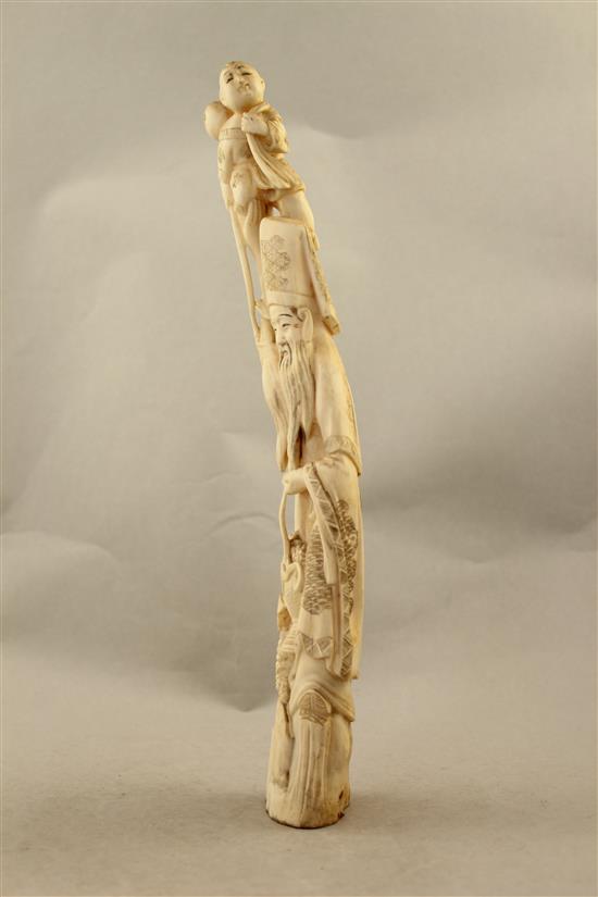 A Japanese walrus ivory tusk carving of Jurojin, early 20th century, 33.5cm